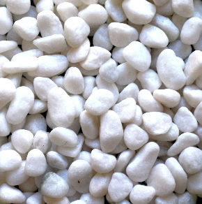 Showing a closeup of Snow white pebbles.