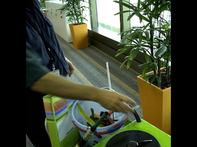 An image of a technician at work using a 100 lite water trolley.