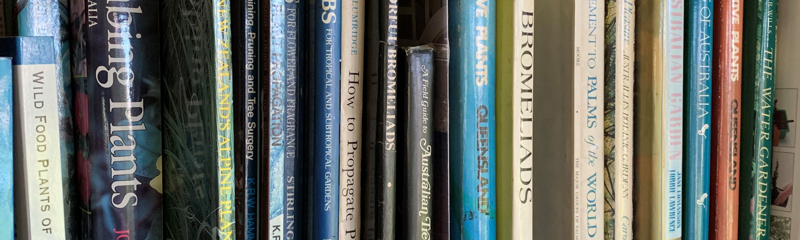 An image showing relevant books i a book case.